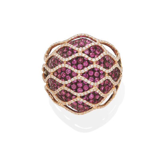an 18k gold and pink sapphire ring