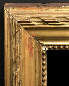 19th Century French School. A Carved Giltwood Mirror