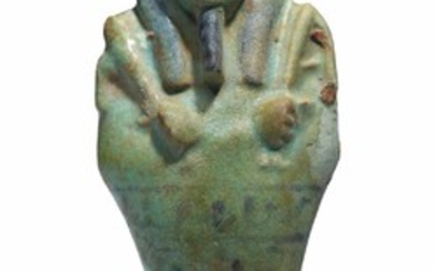 AN EGYPTIAN GREEN FAIENCE SHABTI, LATE PERIOD-PTOLEMAIC PERIOD, CIRCA 390-30 B.C.
