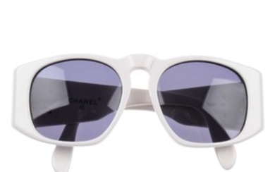 CHANEL - a pair of sunglasses. View more details