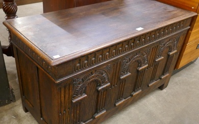A 17th Century style carved oak blanket box