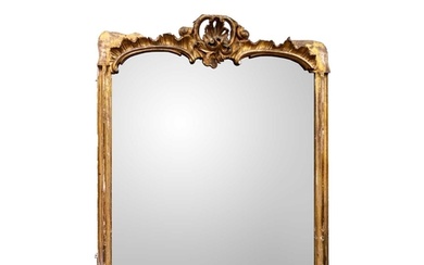 A 19th century carved giltwood overmantel mirror. With ornat...