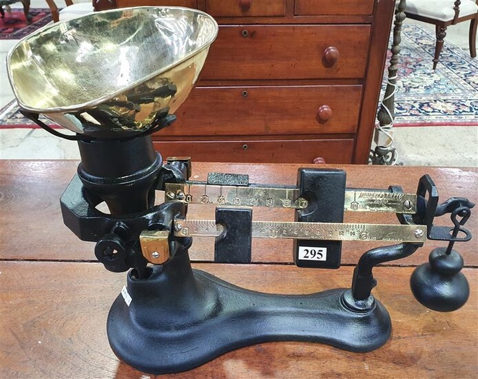 A CAST IRON AND BRASS SET OF SCALES