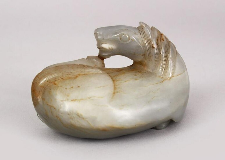 A CHINESE 19TH / 20TH CENTURY CARVED JADE FIGURE OF A