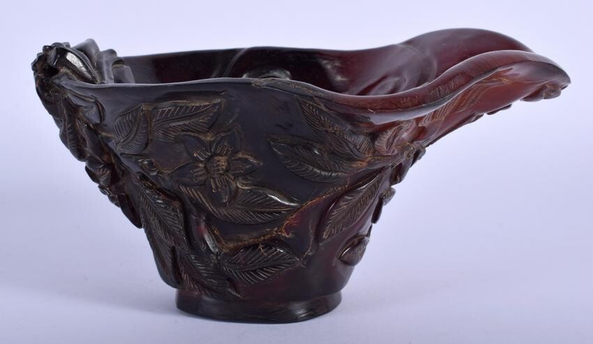 A CHINESE CARVED BUFFALO HORN TYPE LIBATION CUP. 15 cm
