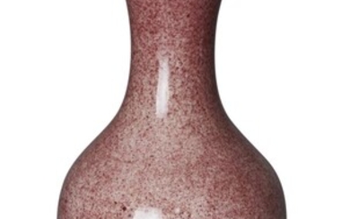 A Chinese monochrome copper red garlic head vase, late Qing dynasty, covered in a mottled copper-red glaze, 17cm high 清晚期 紅釉蒜頭口瓶