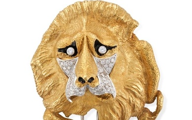A DIAMOND AND ENAMEL LION BROOCH in yellow gold, designed as a lion, set with round brilliant and...