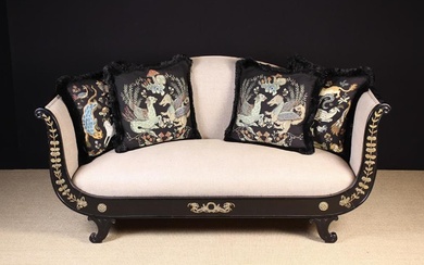 A French Empire Style Scroll-end Settee The black painted frame embellished with gilt metal mounts a