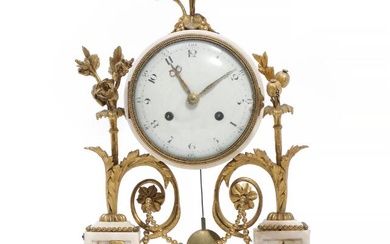 A French Louis XVI gilt bronze and white marble table clock. Late...