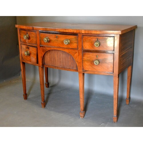 A George IV Mahogany Bow Fronted Sideboard with an arrangeme...