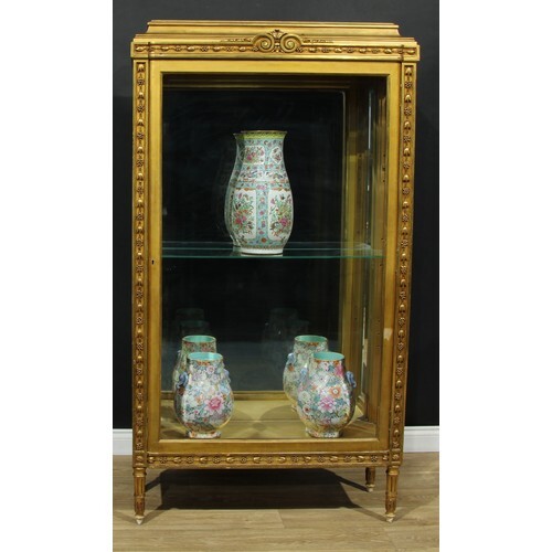 A Louis XVI style giltwood vitrine or display cabinet, pagod...