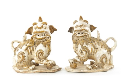 A PAIR OF 19TH CENTURY CHINESE CERAMIC FOO DOGS with gilt hi...