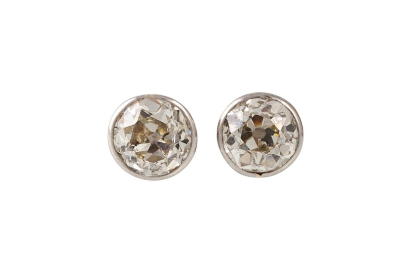 A PAIR OF SOLITAIRE DIAMOND EARRINGS, the diamonds estimated...