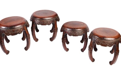 A RARE SET OF FOUR CHINESE HUALI DRUM STOOLS, QING DYNASTY, LATE 18TH/EARLY 19TH CENTURY