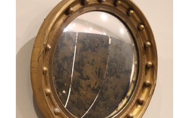 A Regency giltwood and gesso circular convex wall mirror, th...