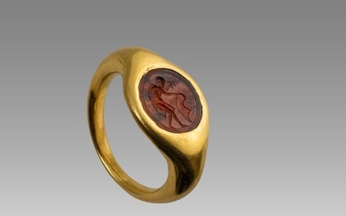 A Roman Gold Ring With Carnelian Intaglio.