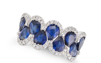 A SAPPHIRE AND DIAMOND RING in 18ct white gold, set with pear cut sapphires accented by round cut