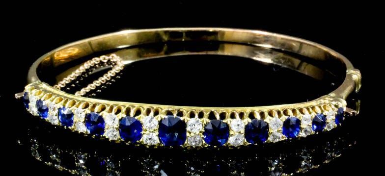 A Sapphire and Diamond Stiff Bangle, Modern, in gold...