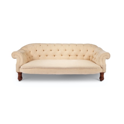 A Victorian Gothic oak button back 'chesterfield' sofa In cr...