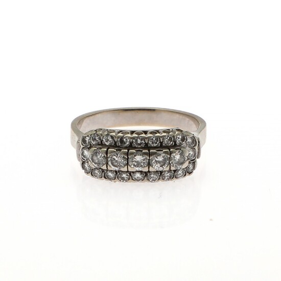A diamond ring set with numerous brilliant-cut diamonds, mounted in 14k white gold. Size app. 54.5.