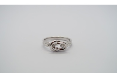 A good quality 18ct white gold diamond Love Knot ring, colou...