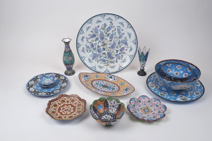 A group of Persian mina-kari enamel copperware, 20th century, comprising: three bowls, three circular plates, a navette shaped dish, two shaped dishes, two vases and a pair of small octagonal dishes, the largest plate 30cm diameter (13)