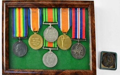 A group of WWI and WWII medals comprising British War...