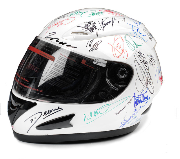 A helmet signed by many racing drivers and motorsport personalities, obtained at the Goodwood Festival of Speed 2015