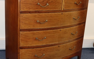 A large Edwardian mahogany bow fronted chest of drawers with...