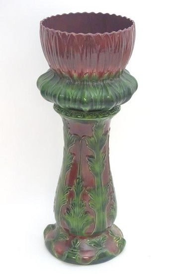 A large Victorian majolica jardiniere on stand of