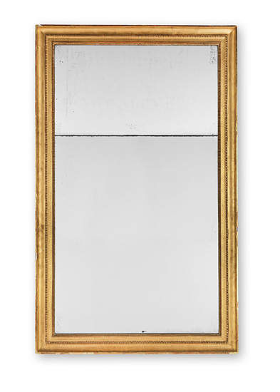 A large early 19th century carved giltwood and gesso mirror