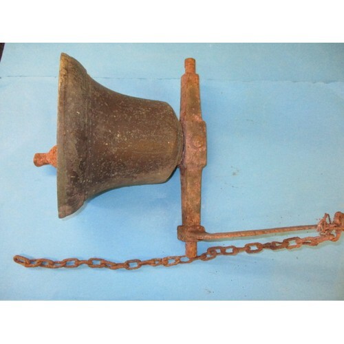 A late 19th century bronze school turret bell with cradle ar...