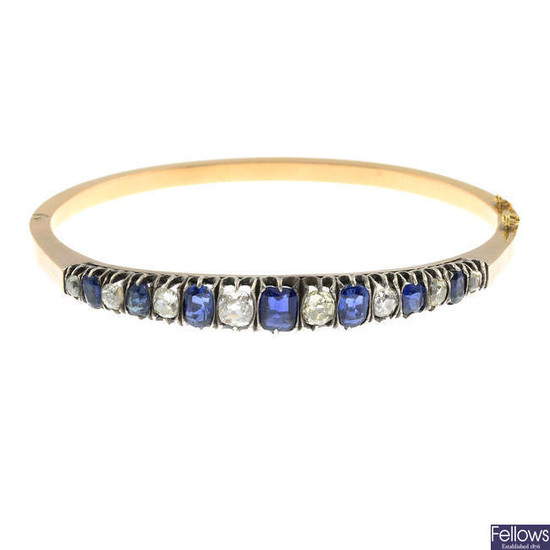 A late 19th century gold sapphire and old-cut diamond bangle.