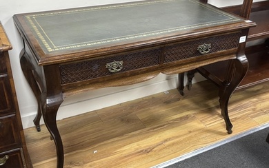 A late Victorian mahogany two drawer writing table, width 11...