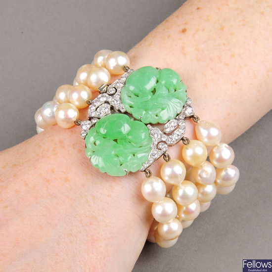 A natural jadeite and diamond clasp, on cultured pearl bracelet.