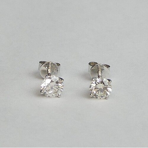 A pair of 18ct white gold diamond stud earrings, approx 1ct....