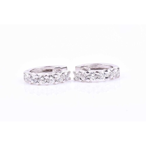 A pair of 18ct white gold half hoop earrings, inset with six...
