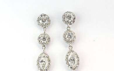 A pair of 18ct white gold (stamped 750) drop earrings set with brilliant and marquise cut diamonds, approx. 1.5ct overall, L. 2.5cm.