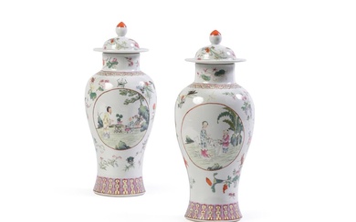 A pair of Chinese Famille Rose vases and covers