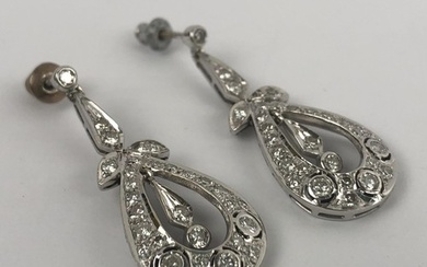 A pair of Edwardian style diamond drop earrings, in a vintag...