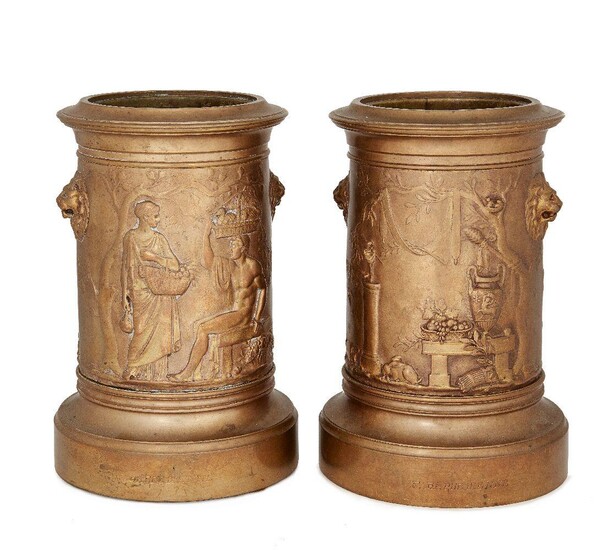A pair of French gilt-bronze jardinieres/bottle coolers, c.1880, by Ferdinand Barbedienne, the bodies cast in relief with classical figures and lion masks, each inscribed F.BARDEDIENNE, 23cm high (2)