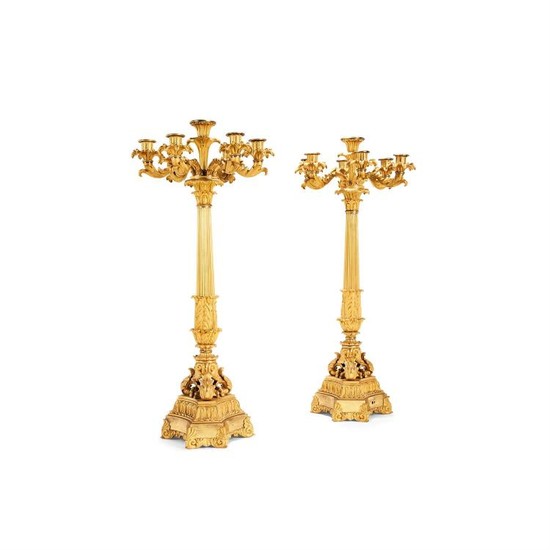 A pair of Restauration gilt bronze seven light candelabra