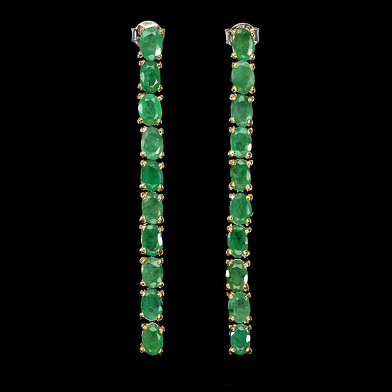 A pair of emerald ear pendants each set with numerous oval-cut emeralds, mounted in rhodium and gold plated sterling silver. L. 5,2 cm. (2)