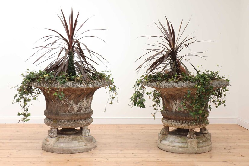 A pair of large composite stone garden planters