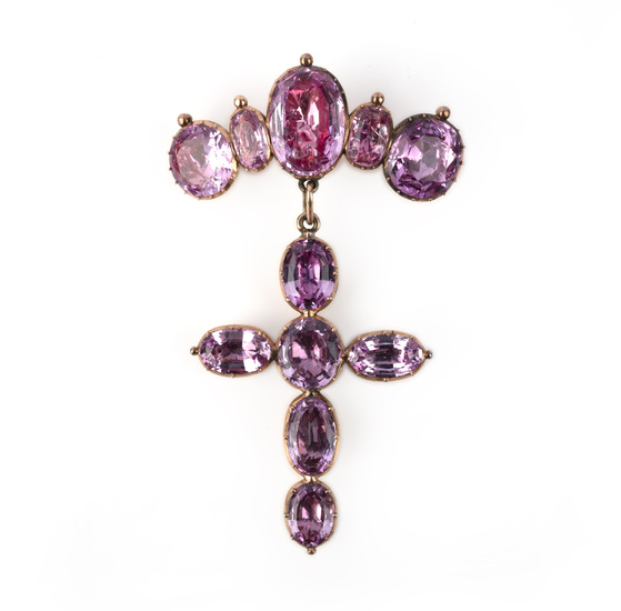 A pink topaz brooch, circa 1820, designed as a line of graduated oval pink topazes