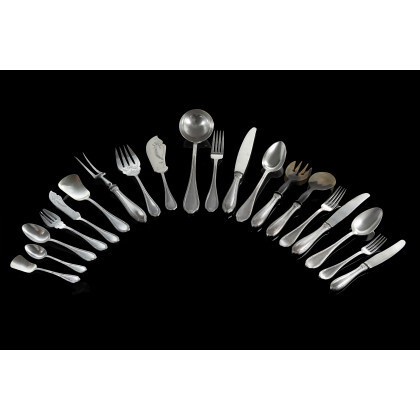 A silver flatware service comprising: twelve forks, spoons and knieves, twelve little forks, twelve little knieves and twelve little spoons,...