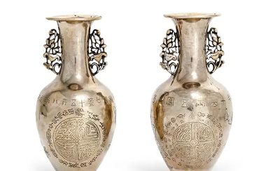A small pair of Chinese silver vases for the domestic market Late...