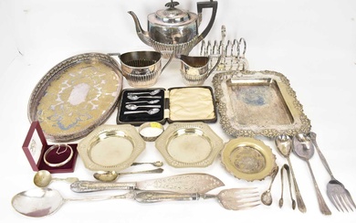 A three-piece silver plated tea set, a toast rack, various...