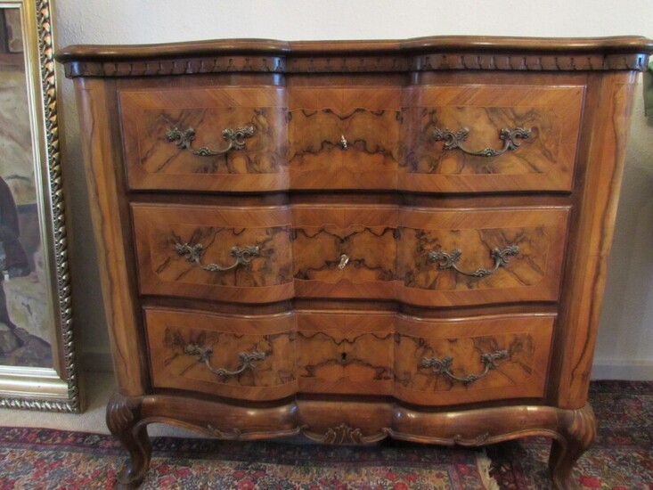 NOT SOLD. A walnut chest of drawers. Rococo style. Early 20th century. H. 100. B....