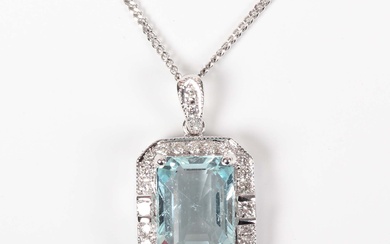 A white gold, aquamarine and diamond cluster pendant, claw set with the cut cornered rectangular ste